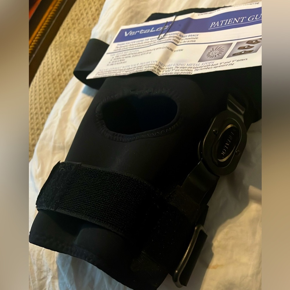 VertaLoc Adjustable Knee Brace, Black with soft blue fabric next to skin